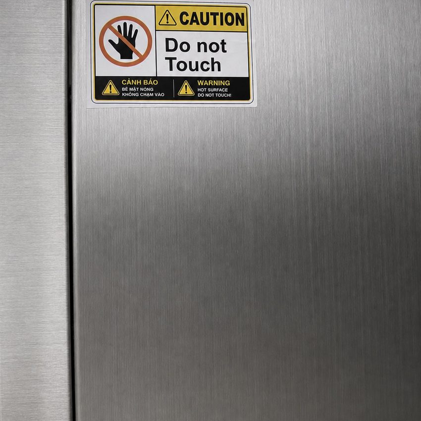 Tem cảnh báo song ngữ Việt - Anh bề mặt nóng, Caution Do not Touch, trên thân inox tủ sấy chén đĩa Hà Tiên
